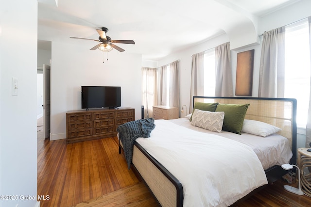 bedroom featuring hardwood / wood-style flooring and a ceiling fan