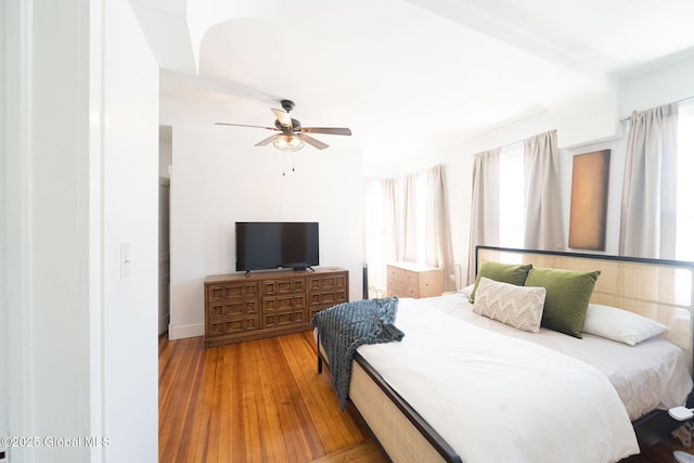 bedroom with a ceiling fan and wood finished floors