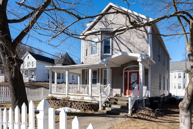 view of front of house with a porch and a fenced front yard