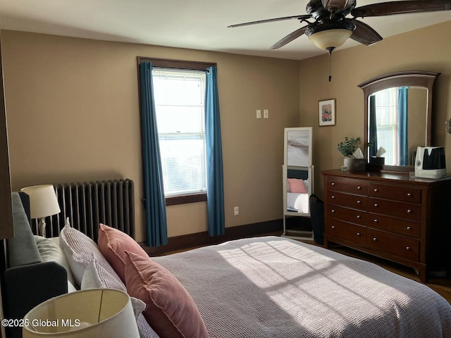 bedroom featuring ceiling fan and radiator heating unit