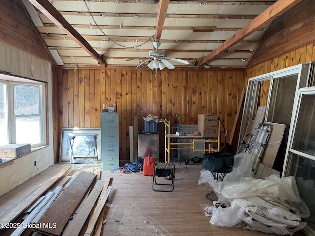 misc room with vaulted ceiling with beams