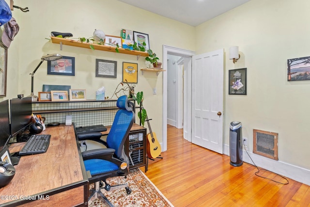 office with light hardwood / wood-style floors