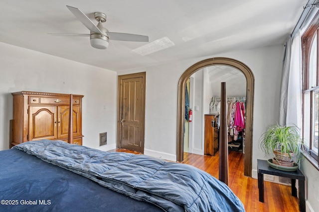 bedroom featuring light hardwood / wood-style flooring, a closet, and ceiling fan