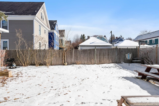 view of yard layered in snow