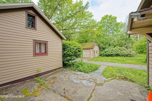 1643 Rte 146, Clifton Park, NY 12148 - view of grassy yard featuring an outbuilding, a patio area, and a shed