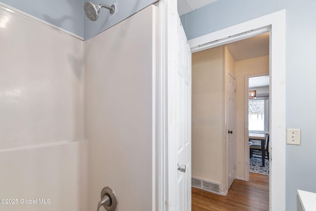 bathroom with hardwood / wood-style floors