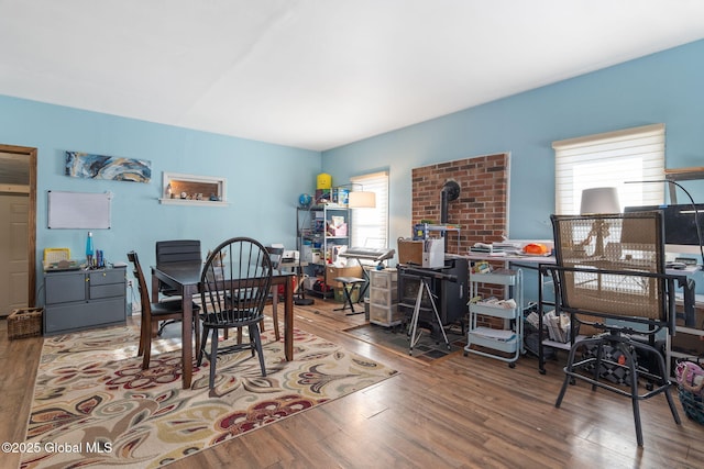 dining space with wood-type flooring