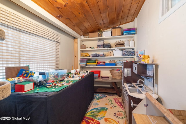 recreation room featuring sink and wooden ceiling