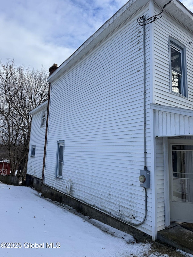 view of snow covered property