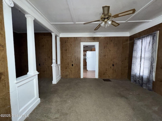 spare room with ceiling fan, ornamental molding, carpet, and ornate columns