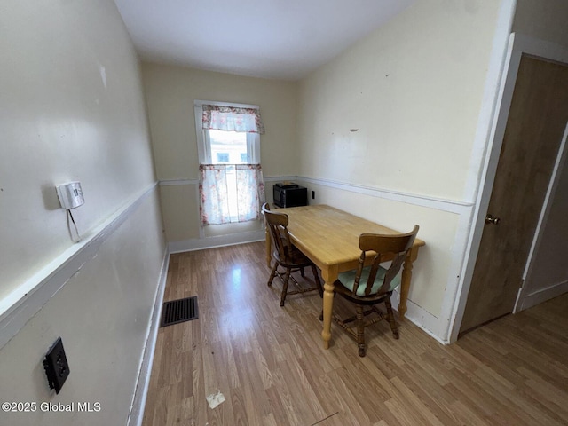 dining room featuring light hardwood / wood-style floors