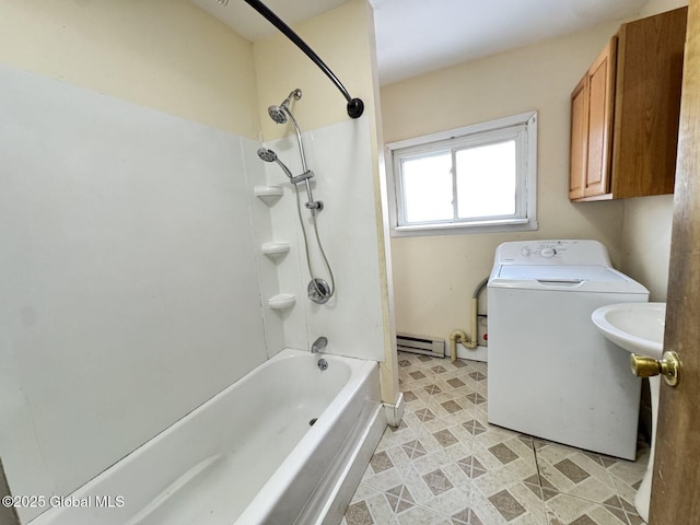 bathroom featuring toilet, a baseboard radiator,  shower combination, and washer / clothes dryer