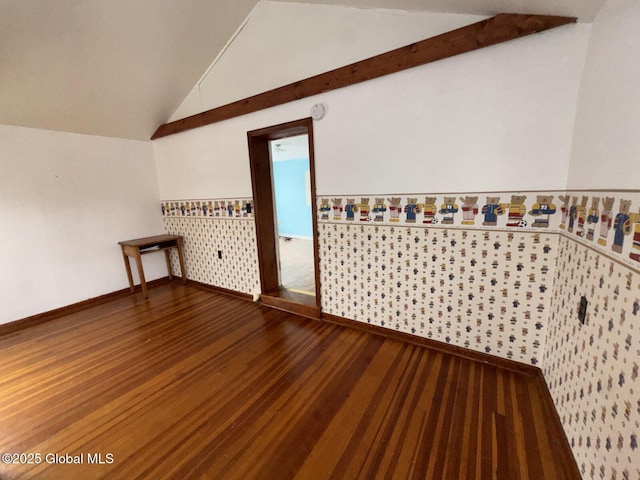 additional living space featuring vaulted ceiling and wood-type flooring