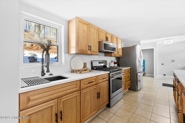 kitchen with decorative backsplash, stainless steel appliances, and light tile patterned flooring