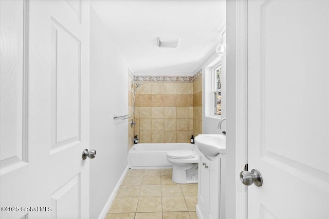 full bathroom featuring tile patterned flooring, vanity, tiled shower / bath combo, and toilet