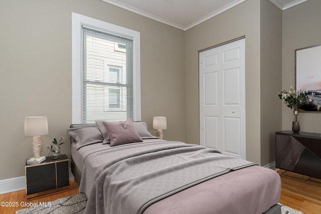 bedroom featuring hardwood / wood-style floors and ornamental molding