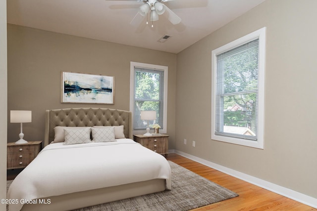 bedroom with hardwood / wood-style flooring and ceiling fan