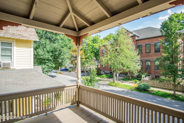 wooden deck with cooling unit and a gazebo