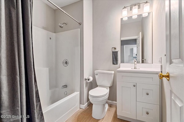 full bathroom with vanity, wood-type flooring, shower / tub combo with curtain, and toilet