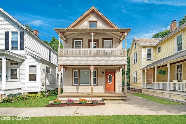 victorian home with a balcony and a porch