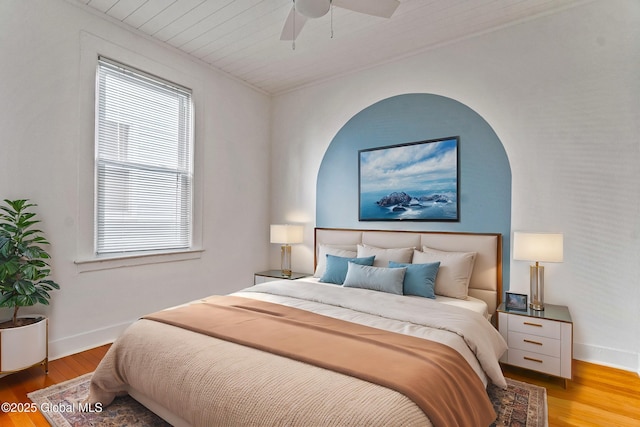 bedroom featuring hardwood / wood-style floors and ceiling fan