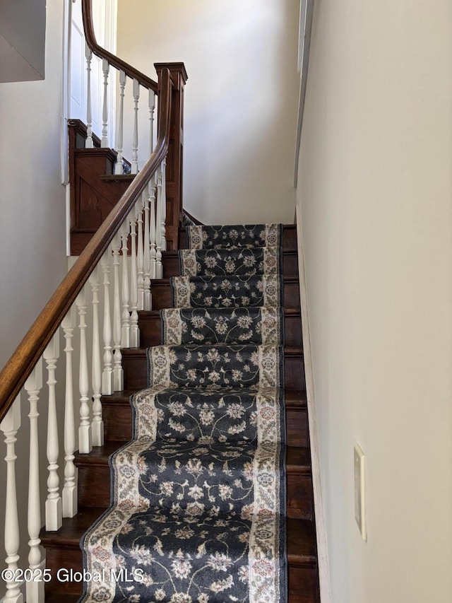 stairs with hardwood / wood-style floors