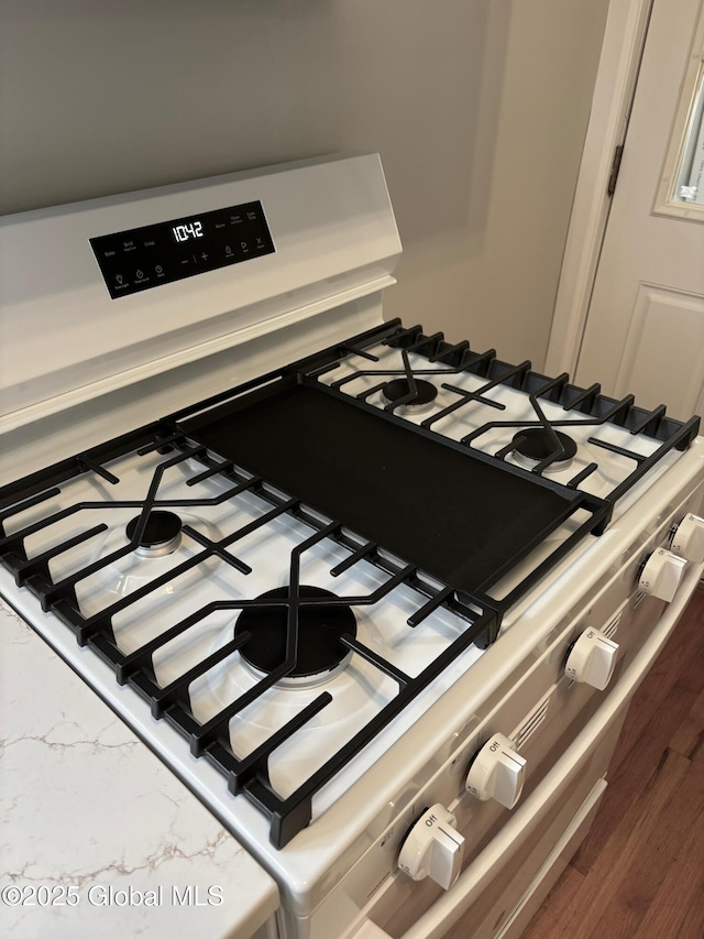 room details with white gas range oven