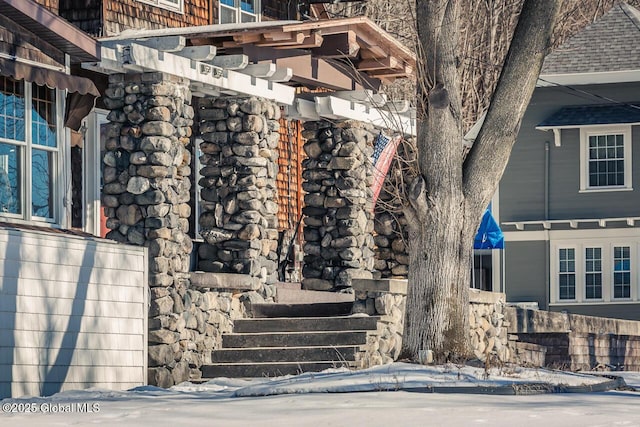 view of snow covered property entrance