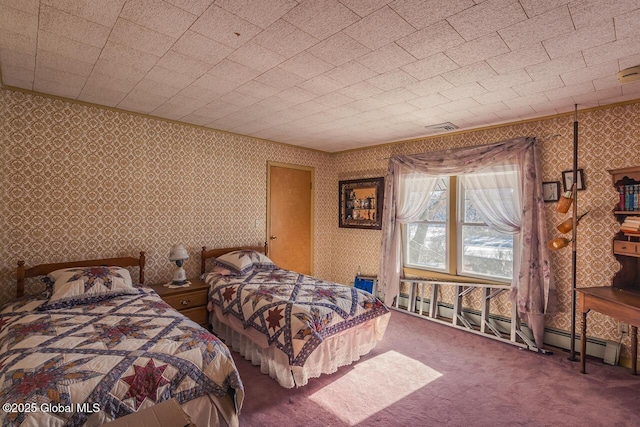 carpeted bedroom featuring baseboard heating