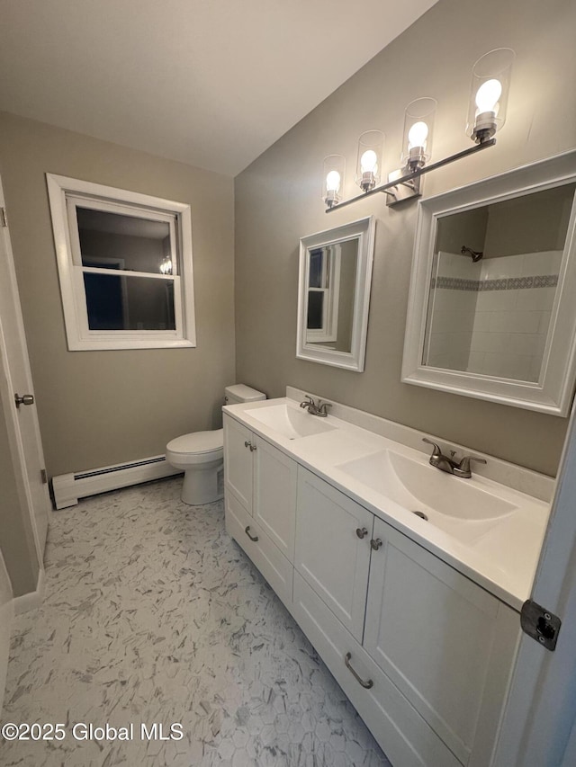 bathroom featuring a baseboard radiator, vanity, and toilet