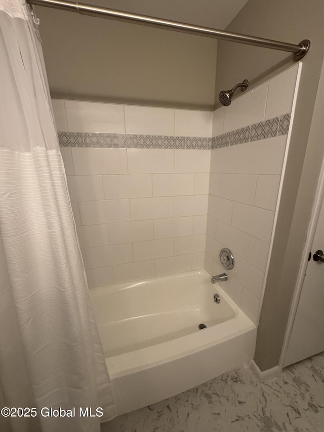 bathroom with shower / tub combo