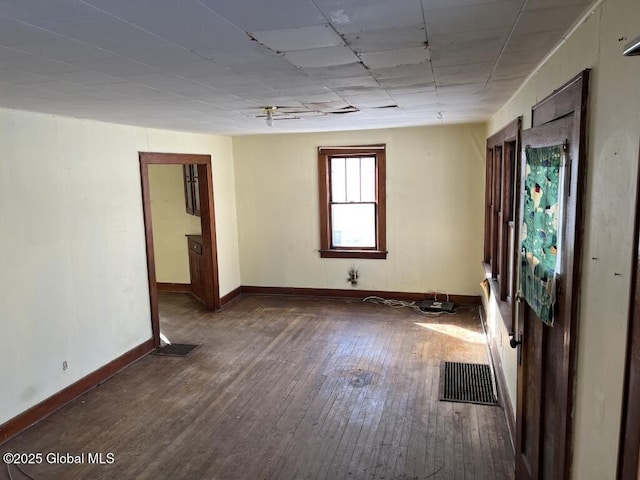 spare room featuring dark hardwood / wood-style floors