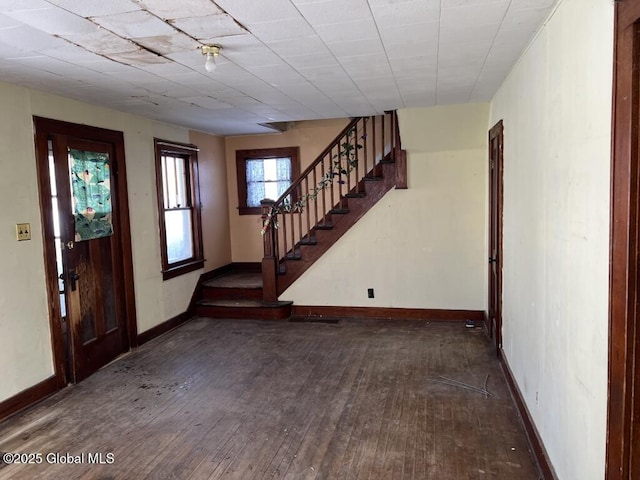 foyer entrance with dark hardwood / wood-style floors