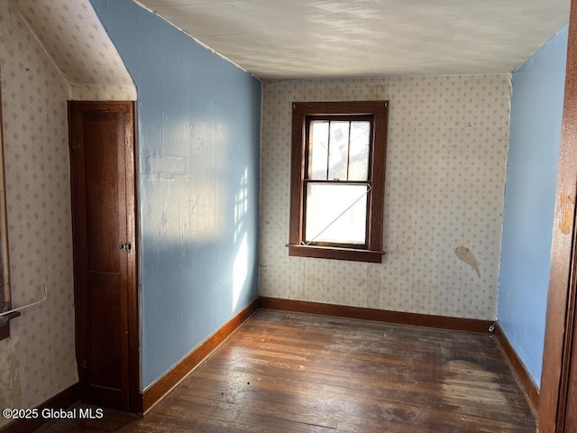 unfurnished room with dark hardwood / wood-style floors