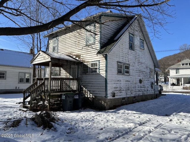 view of snow covered property