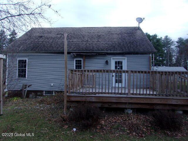 back of property featuring a wooden deck