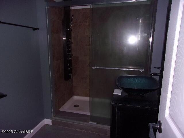 bathroom with vanity and an enclosed shower