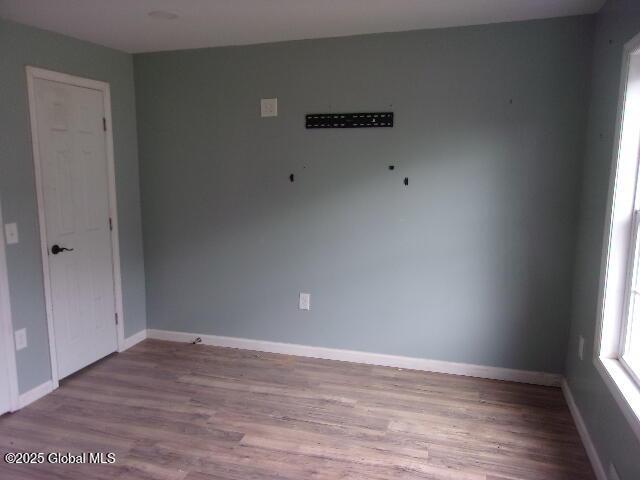 spare room featuring light hardwood / wood-style flooring