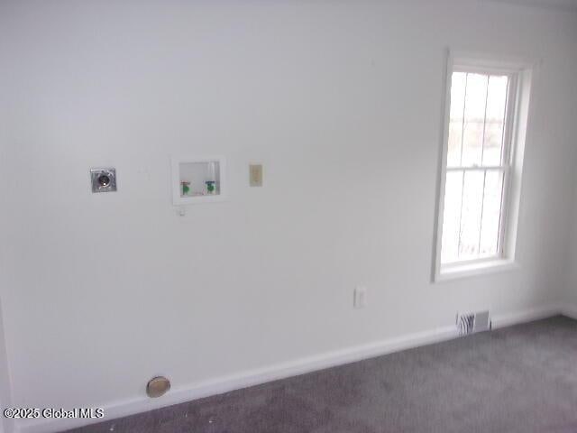 clothes washing area featuring washer hookup, carpet floors, and electric dryer hookup