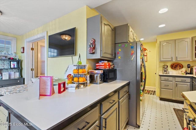 kitchen featuring stainless steel fridge