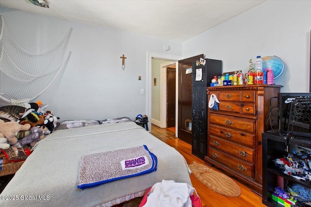 bedroom featuring wood-type flooring