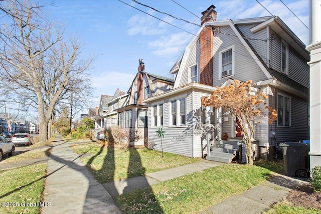 view of property exterior with a lawn