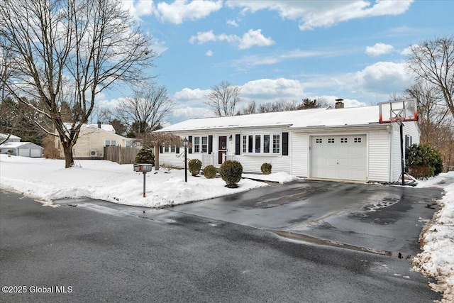 ranch-style house featuring a garage