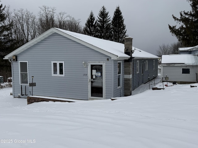 view of snow covered house