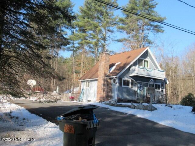 view of front of home with a balcony