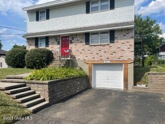 view of front of home with an attached garage and driveway