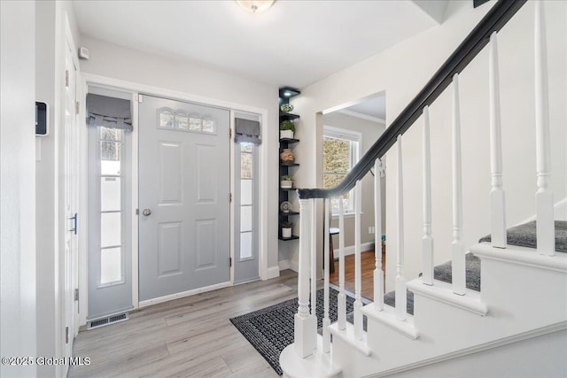 entryway featuring light hardwood / wood-style flooring and a wealth of natural light