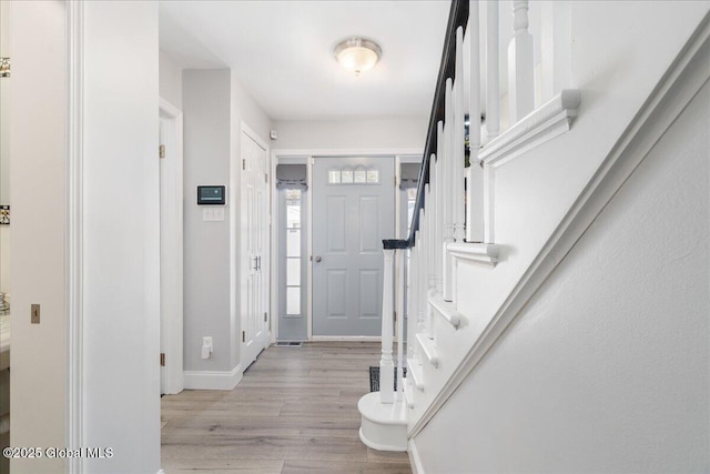 foyer entrance with light hardwood / wood-style flooring