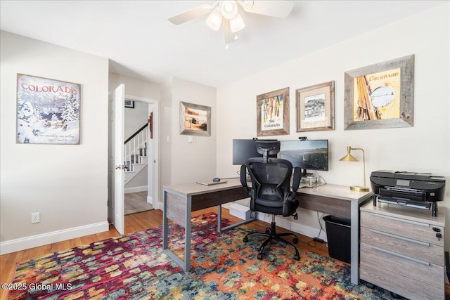 office space with ceiling fan and light hardwood / wood-style floors