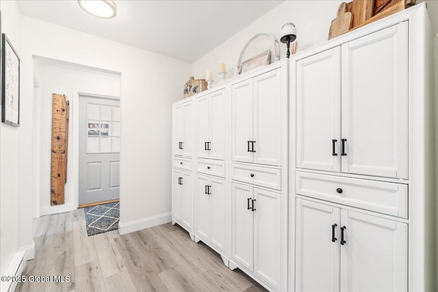 hall with light hardwood / wood-style flooring